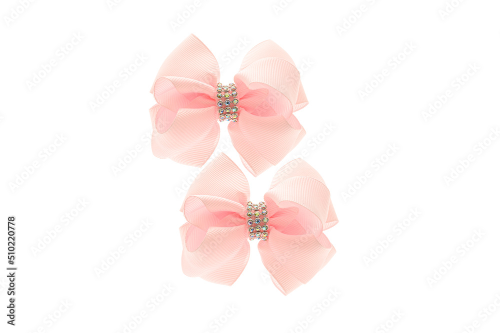 Pink satin bow for hair for girl, woman isolated on white background. Scrunchie hair clip accessory for girls and women. Close up Pink satin bow for hair for girl, woman isolated on white background. Scrunchie hair clip accessory for girls and women. Close up