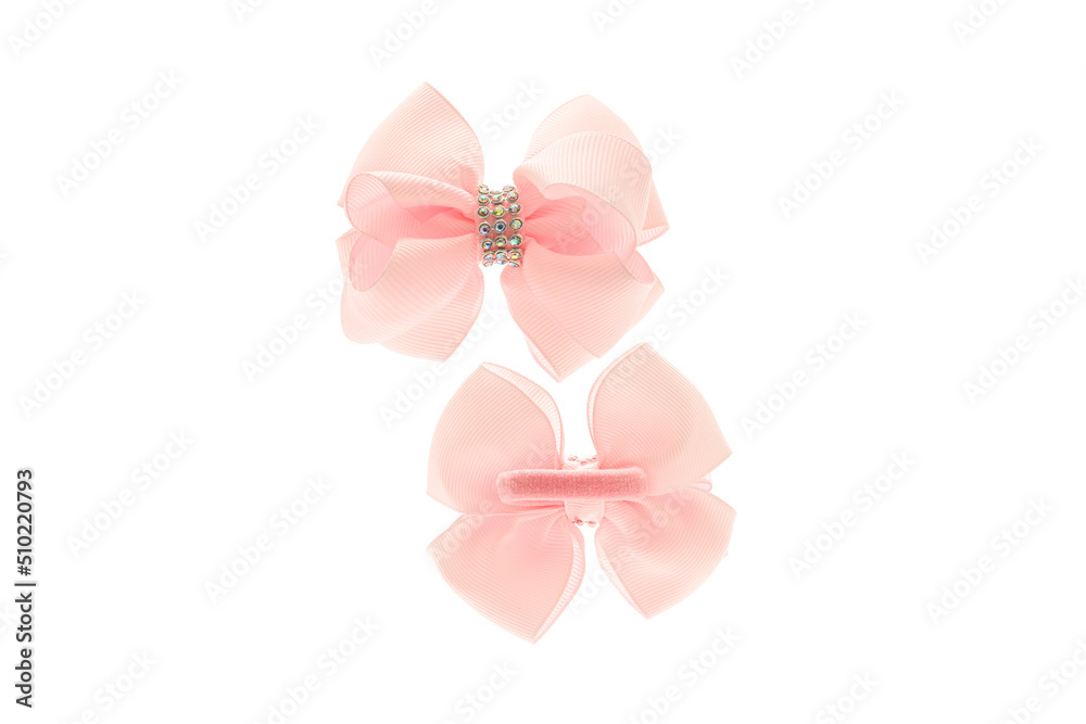 Pink satin bow for hair for girl, woman isolated on white background. Scrunchie hair clip accessory for girls and women. Close up