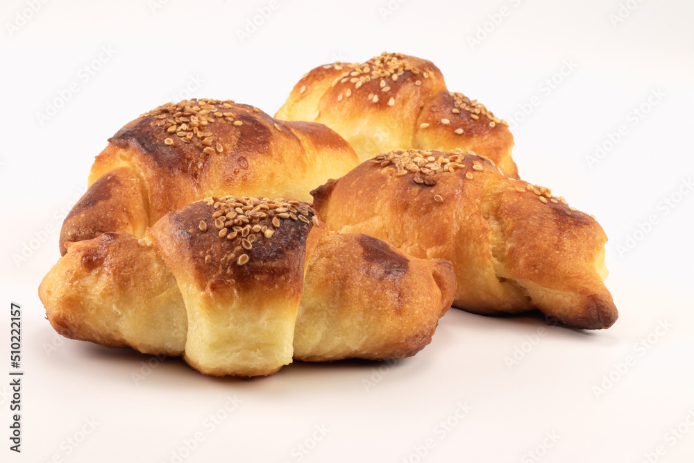 Close up on homemade rolls stuffed with cheese sprinkled with sesame seeds. Close up on homemade rolls stuffed with cheese sprinkled with sesame seeds.