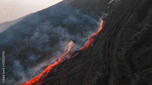 Colata di lava sul vulcano Etna in eruzione -Sicilia dall'alto photo