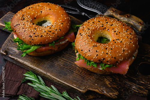 Fresh Smoked Salmon And Cream Cheese Bagel, on old dark  wooden table background