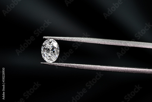 Oval shape diamond with tweezers