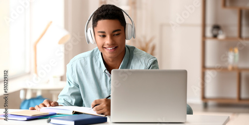 African-American guy studyi...