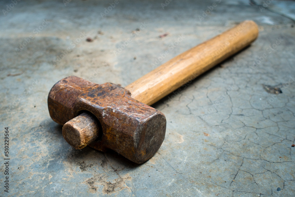 A bulky vintage cast iron hammer with natural wooden handle. uttarakhand  India Stock-Foto | Adobe Stock