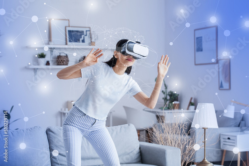 Woman with VR glasses using...