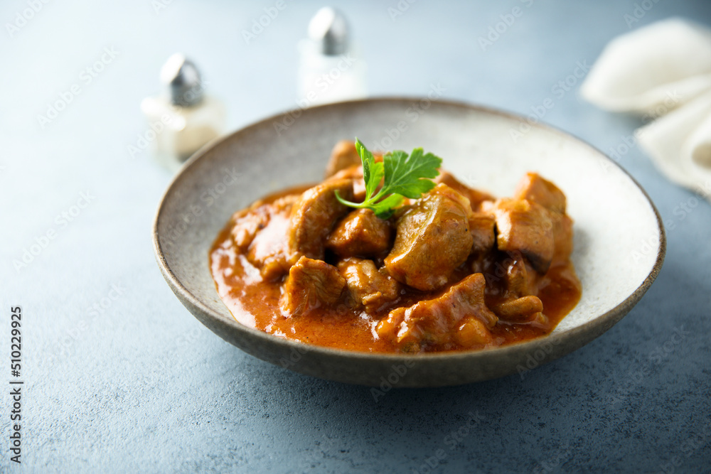 Homemade pork ragout with tomato sauce Homemade pork ragout with tomato sauce