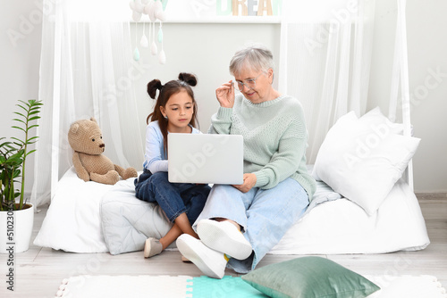Little girl with her grandm...