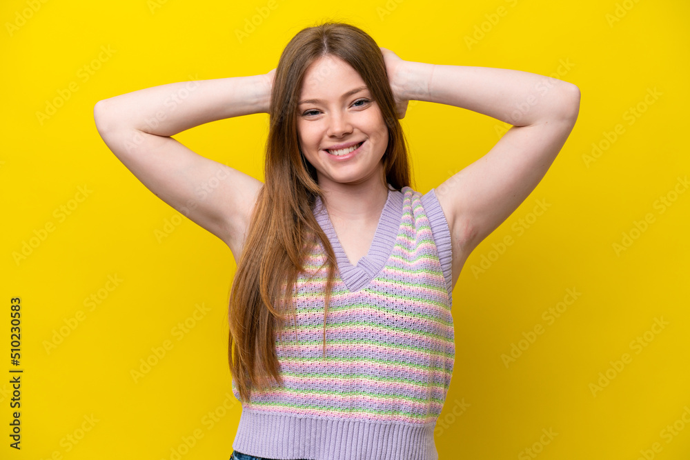 Young caucasian woman isolated on yellow background laughing