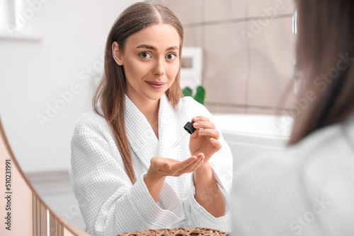 Beautiful young woman using...