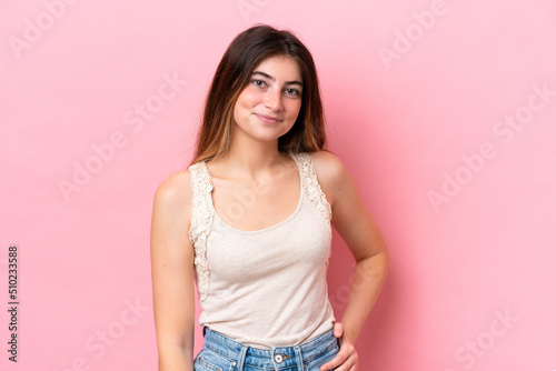 Young caucasian woman isolated on pink background laughing