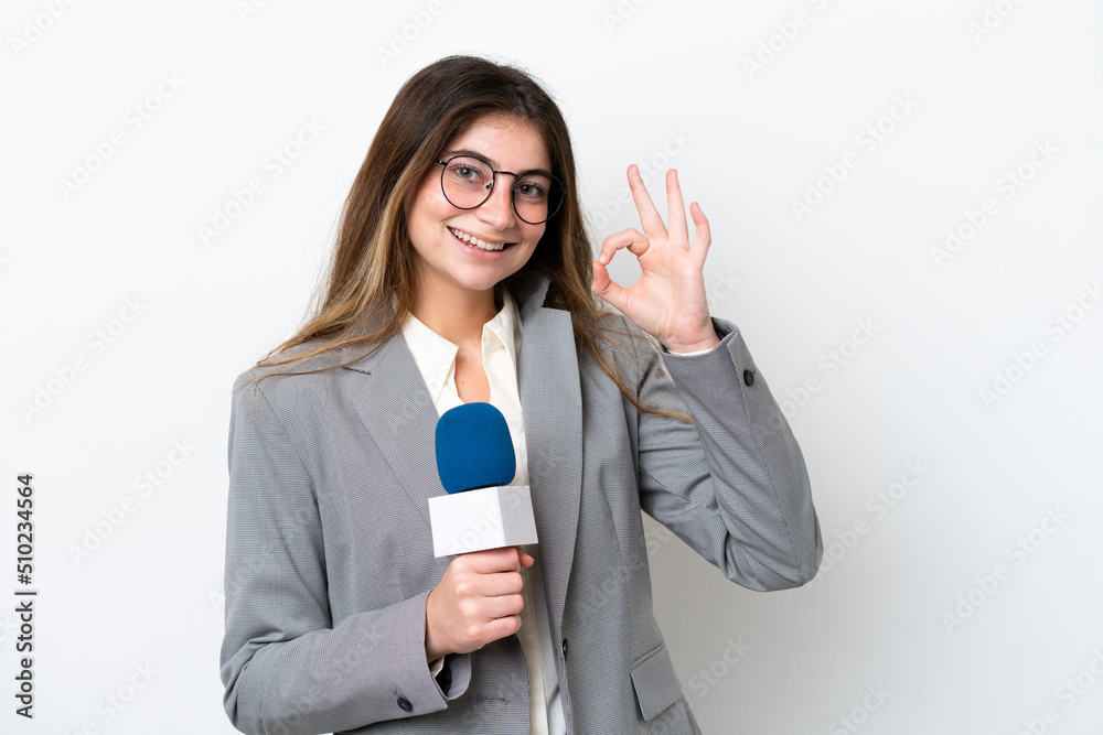 Young caucasian TV presenter woman isolated on white background showing ok sign with fingers Young caucasian TV presenter woman isolated on white background showing ok sign with fingers