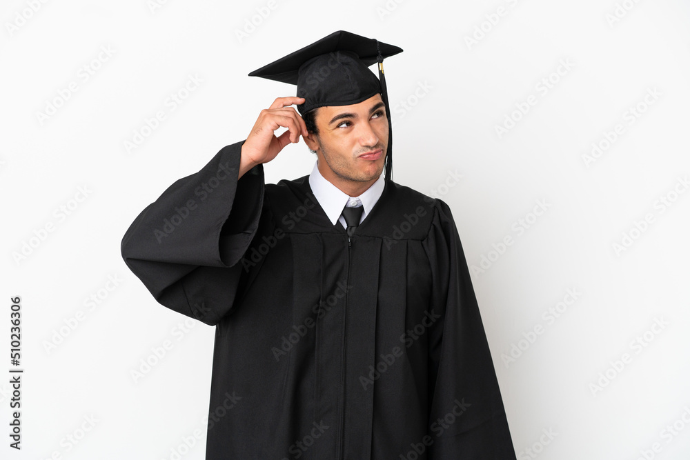 Young university graduate over isolated white background having doubts and with confuse face expression Young university graduate over isolated white background having doubts and with confuse face expression