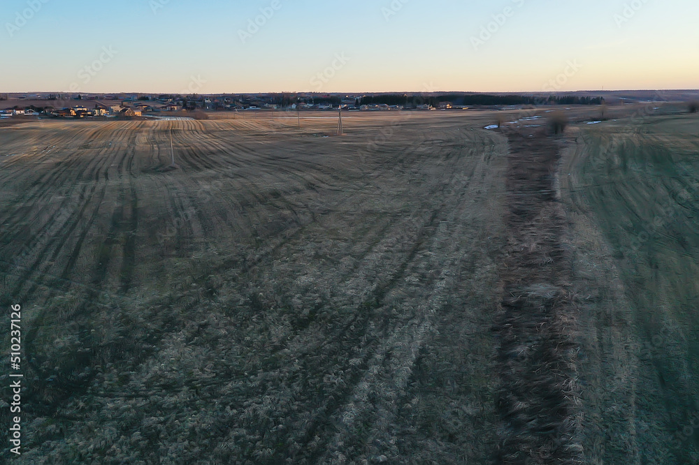 Naklejka premium early spring field top view drone, abstract landscape flight