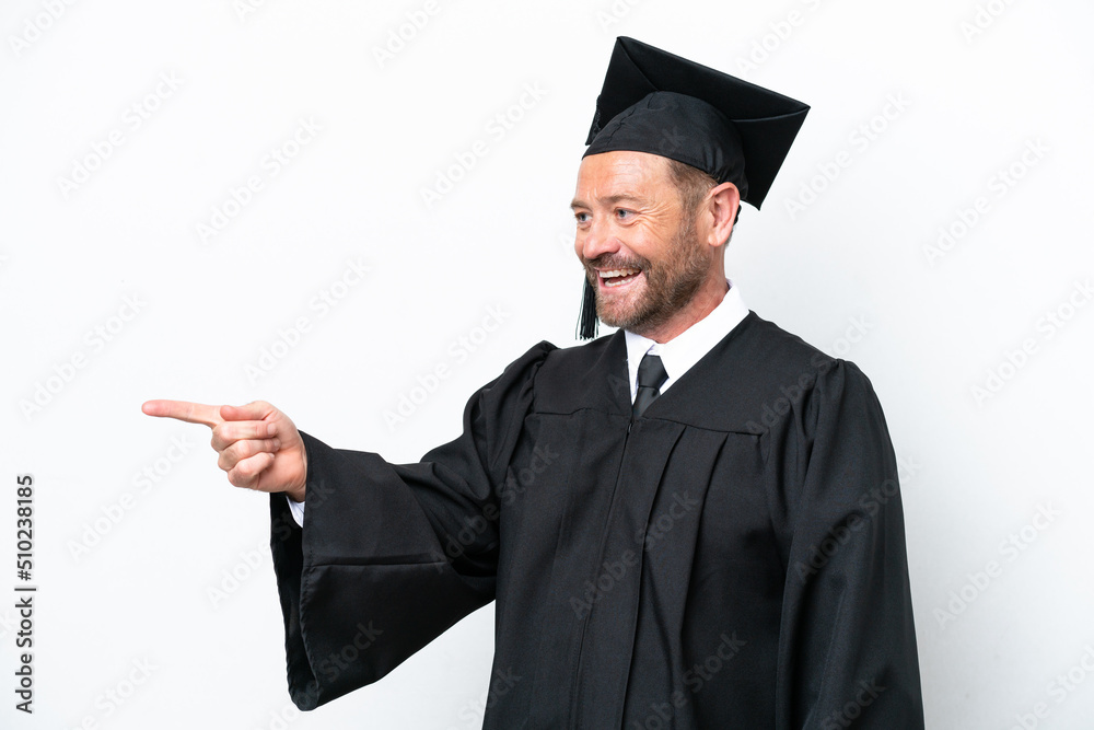 Middle age university graduate man isolated on white background pointing finger to the side and presenting a product Middle age university graduate man isolated on white background pointing finger to the side and presenting a product