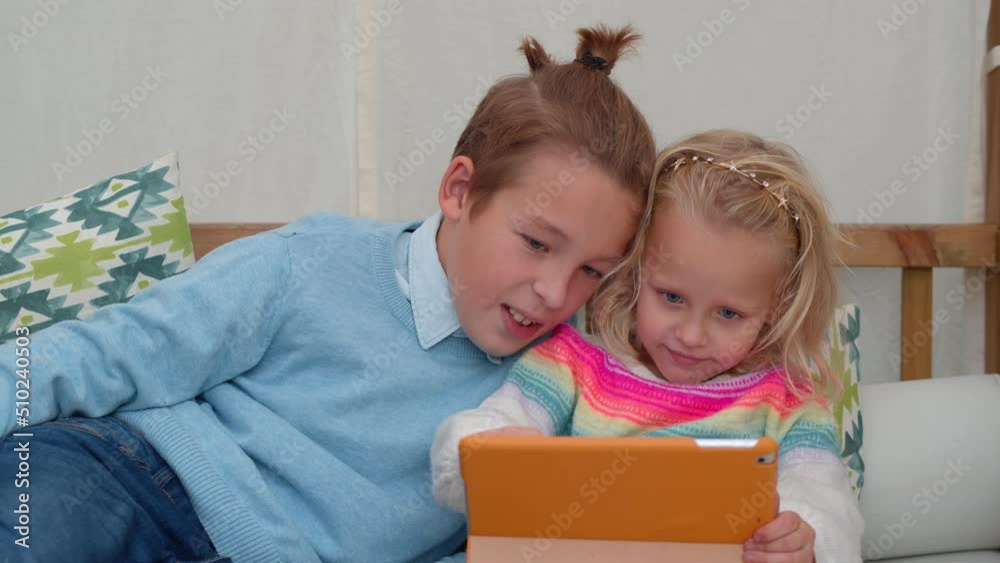 Brother and sister playing computer games