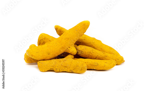 Turmeric root and powder on a white background close-up isolated. Useful spices, Indian roots and herbs. Medicinal folk ingredients for food.