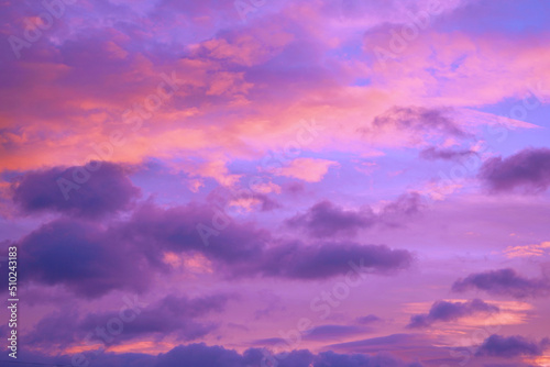  Purple orange pink sunset. Beautiful evening sky with clouds background for design. 