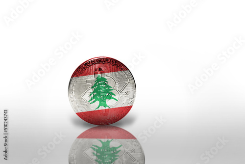 bitcoin with the national flag of lebanon on the white background. bitcoin mining concept. photo