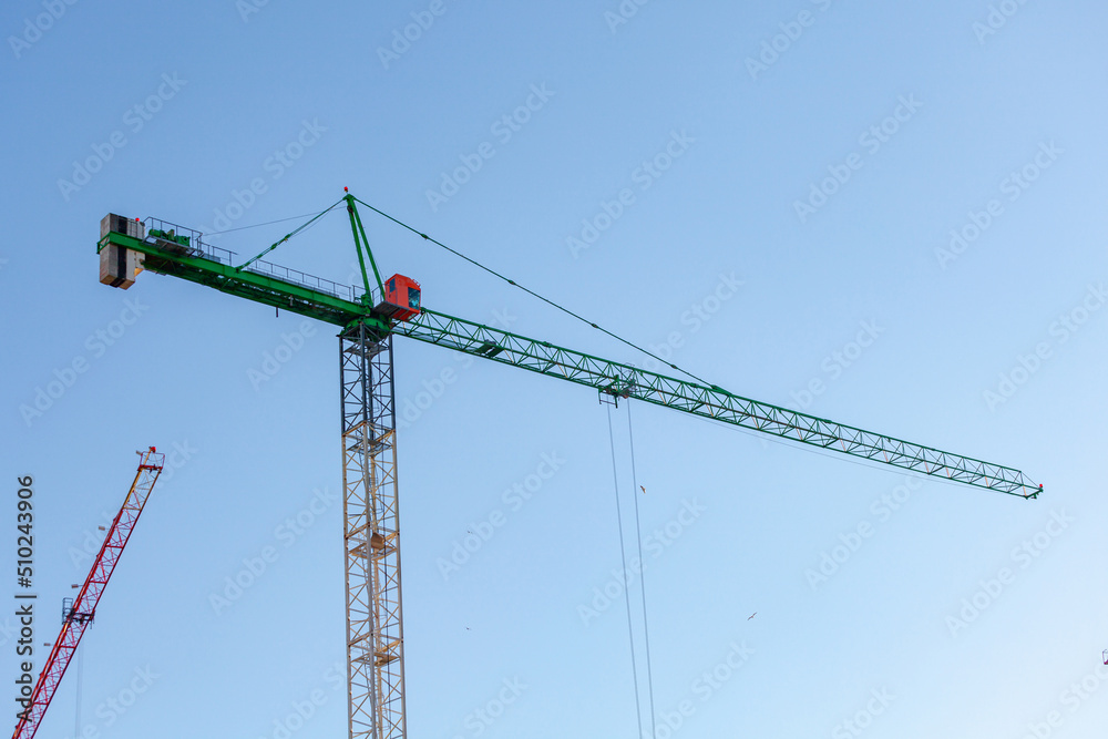 The Crane tower in construction site of a high-rise condominium. Architecture