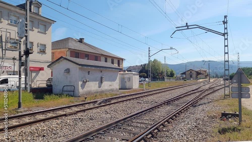 Freight train with a locomotive from the Renfe company at the head and dragging wagons entering the San Clodio - Quiroga station without stopping photo