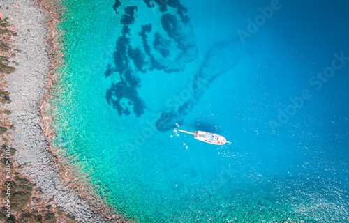 Aerial view drone shot of islands in summer with Yacht in beach
