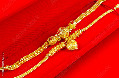 Gold Bracelet in red velvet box container.