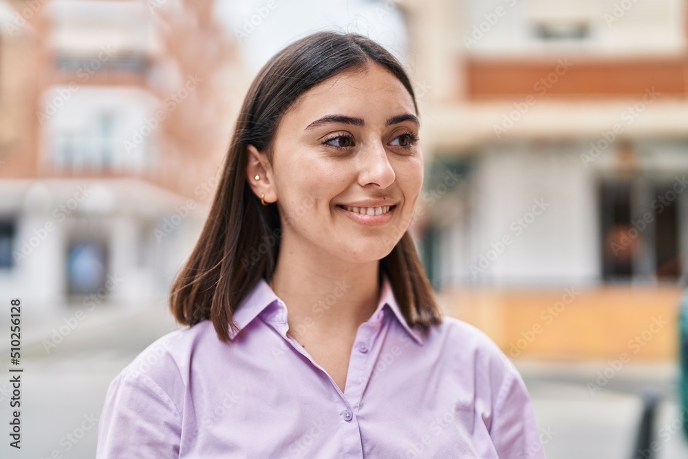 Young hispanic woman smiling confident standing at street Young hispanic woman smiling confident standing at street