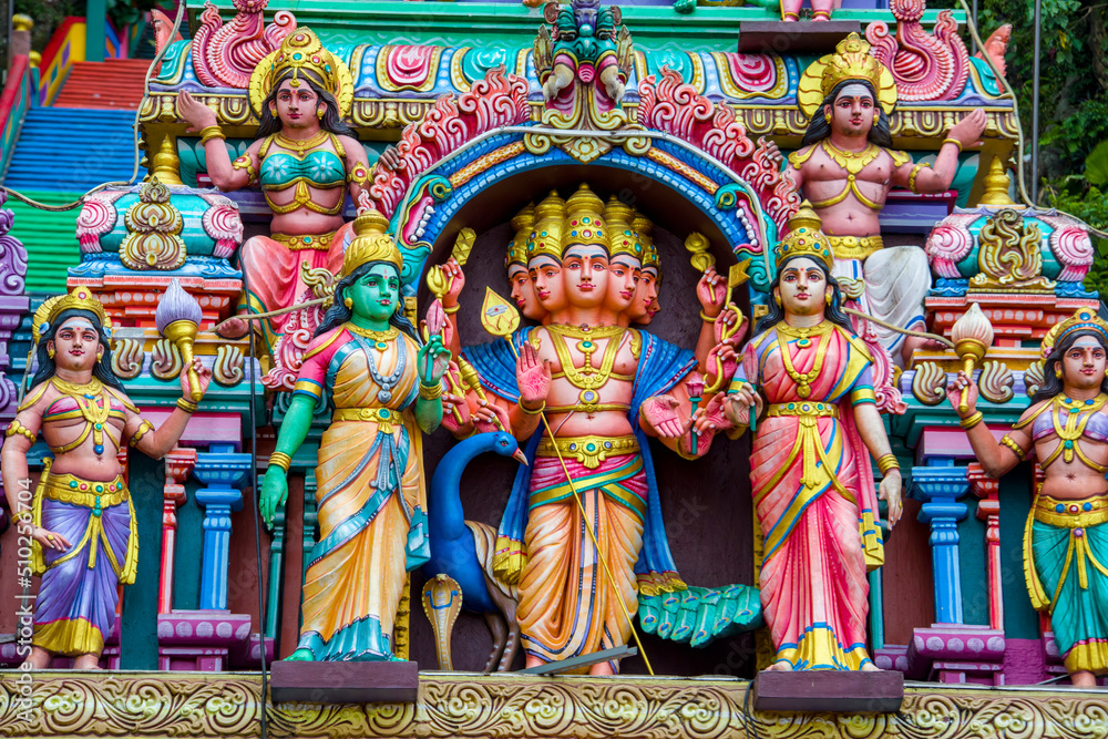 The God sculpture main entrance of Batu Caves in Gombak, Selangor, Malaysia,  which is one of the most popular Hindu shrines outside India.
The background is 272 colorful steps.