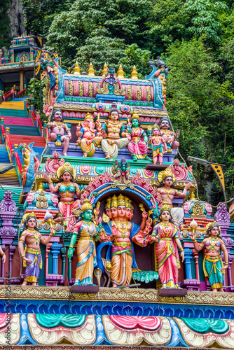 The God sculpture main entrance of Batu Caves in Gombak, Selangor, Malaysia, which is one of the most popular Hindu shrines outside India. The background is 272 colorful steps.