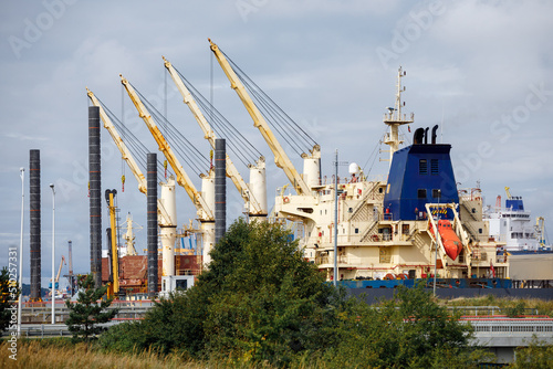 Fotografie Landscape of Klaipeda port with ships, containers, ferries and cranes