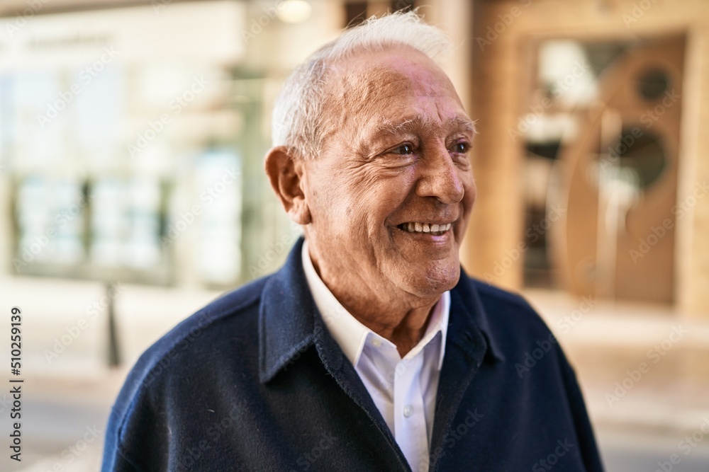 Senior man smiling confident standing at street Senior man smiling confident standing at street