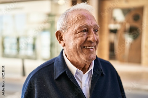 Senior man smiling confident standing at street
