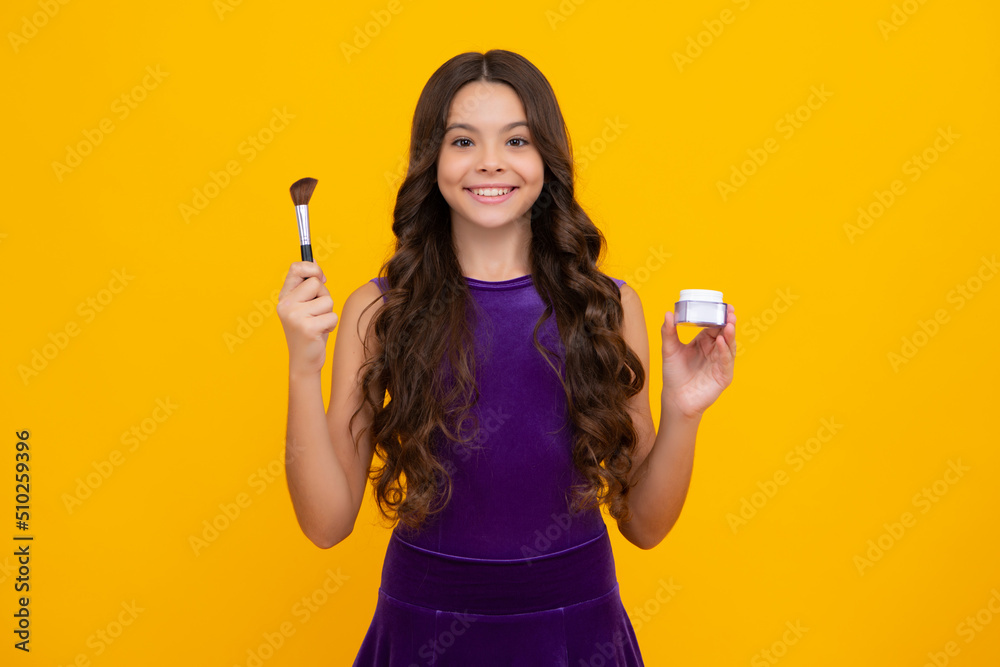 Child girl 12, 13, 14 years old making beauty make up with powder and brush. Beautiful teenager applying makeup. Happy girl face, positive and smiling emotions. Child girl 12, 13, 14 years old making beauty make up with powder and brush. Beautiful teenager applying makeup. Happy girl face, positive and smiling emotions.