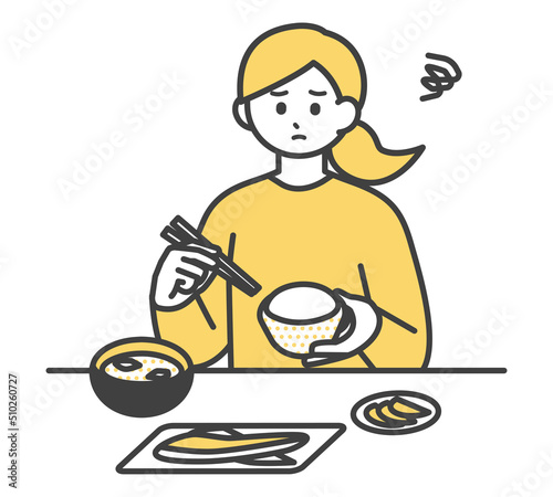 食事をする女性のイラスト素材