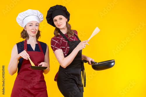 Women in chef's hats. House...