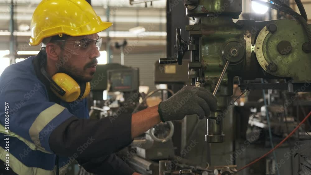 Maintenance engineer checking machinery in factory. Maintenance engineer checking machinery in factory.