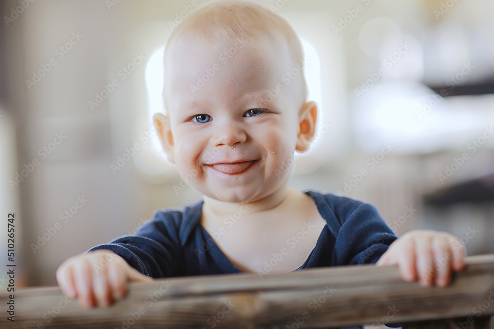 small child is laughing smiling a cheerful kid small child is laughing smiling a cheerful kid