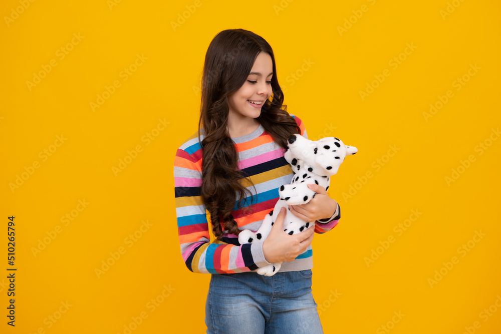 Cheerful teen child hold toy. Happy childhood. Kid playing toy. Childcare concept. Happy teenager, positive and smiling emotions of teen girl. Cheerful teen child hold toy. Happy childhood. Kid playing toy. Childcare concept. Happy teenager, positive and smiling emotions of teen girl.