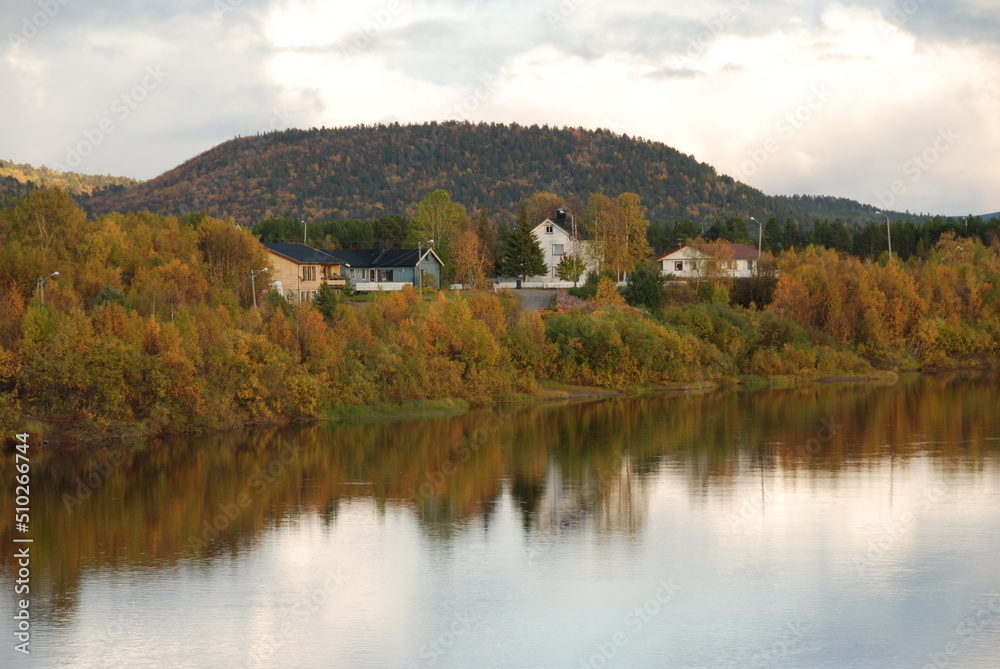Karasjok village reflected in a river, Finnmark, Norway
