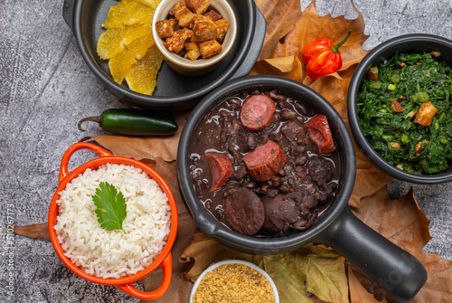 FEIJOADA: typical and traditional food of Brazilian cuisine, served with rice, farofa, orange, pepper and cabbage