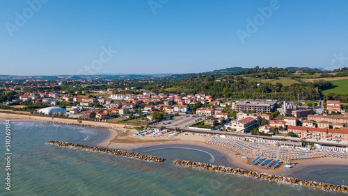 Italy, June 2022  aerial view of Fano with its sea, beaches, port, umbrellas in the marche region © cristian