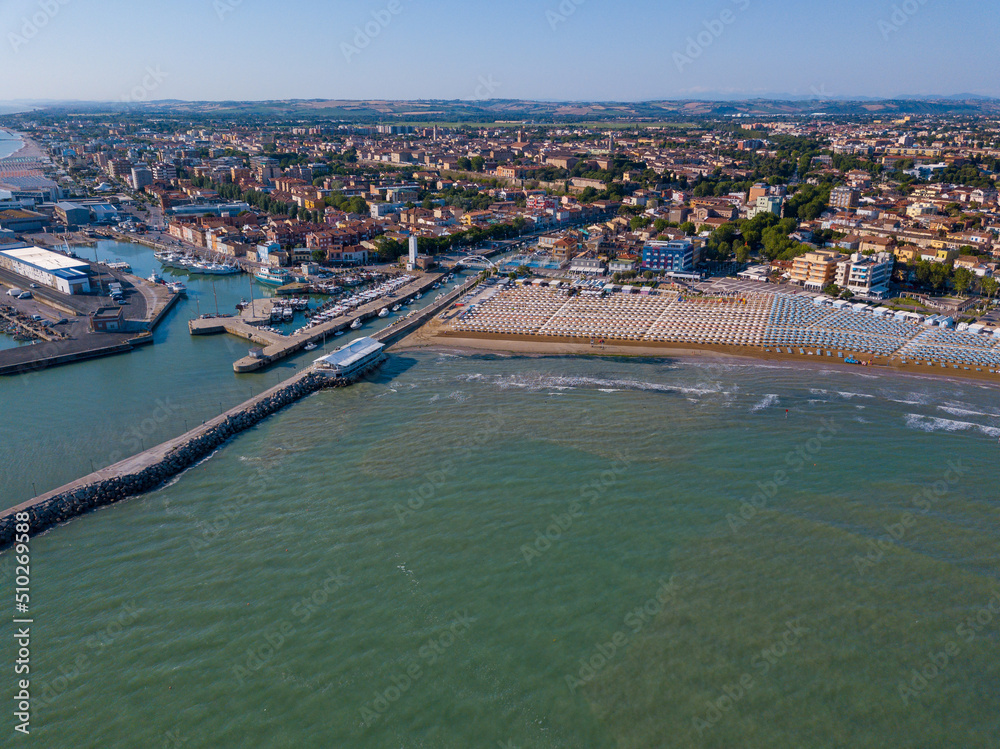 Fototapeta premium Italy, June 2022; aerial view of Fano with its sea, beaches, port, umbrellas in the marche region