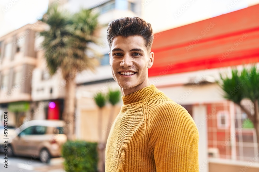 Young hispanic man smiling confident standing at street Young hispanic man smiling confident standing at street