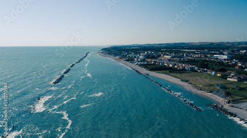 Italy, June 2022  aerial view of Fano with its sea, beaches, port, umbrellas in the marche region © cristian