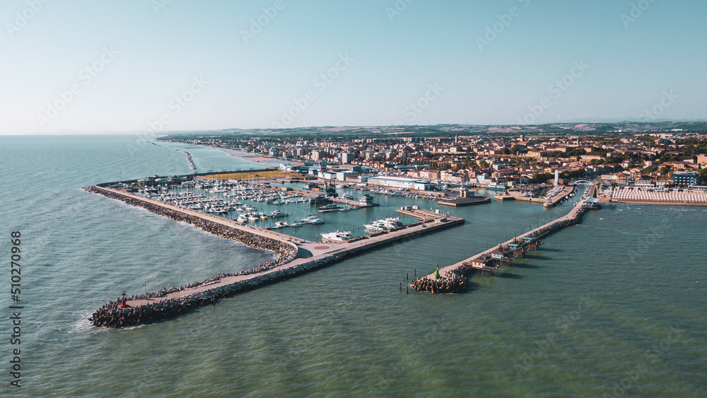 Italy, June 2022; aerial view of Fano with its sea, beaches, port, umbrellas Italy, June 2022; aerial view of Fano with its sea, beaches, port, umbrellas