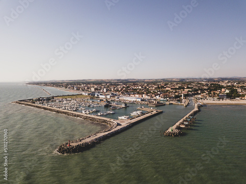 Italy, June 2022  aerial view of Fano with its sea, beaches, port, umbrellas © cristian