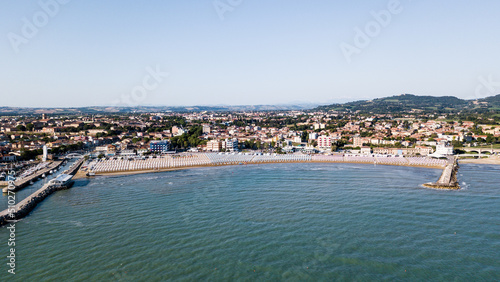 Fototapeta Naklejka Na Ścianę i Meble -  Italy, June 2022; aerial view of Fano with its sea, beaches, port, umbrellas