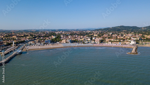 Fototapeta Naklejka Na Ścianę i Meble -  Italy, June 2022; aerial view of Fano with its sea, beaches, port, umbrellas
