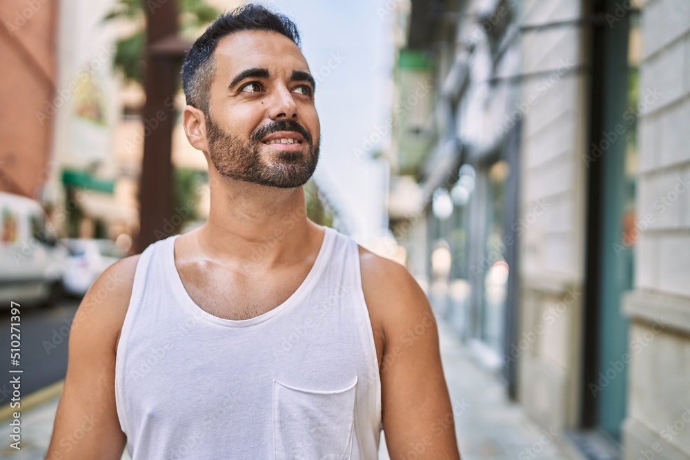 Hispanic sports man wearing workout style outdoors on a sunny day Hispanic sports man wearing workout style outdoors on a sunny day