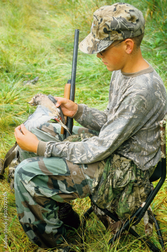 A young hunter with a dove